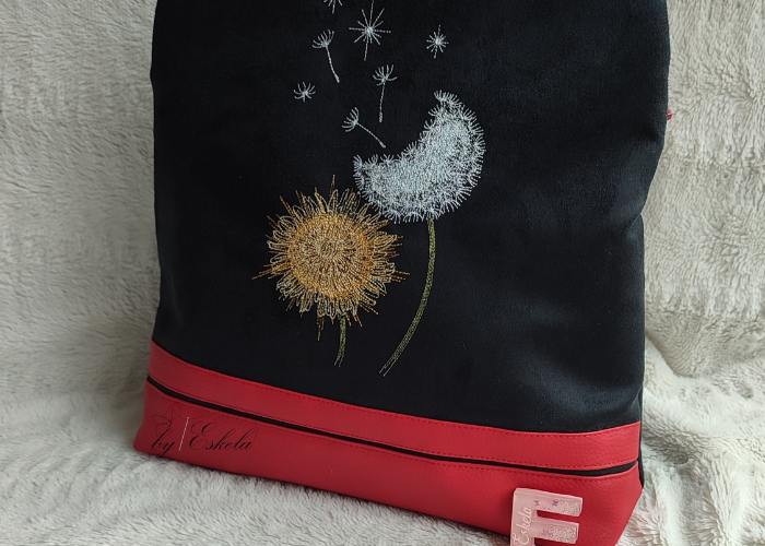 Sac à dos Volte noir et rouge avec un motif pissenlit
